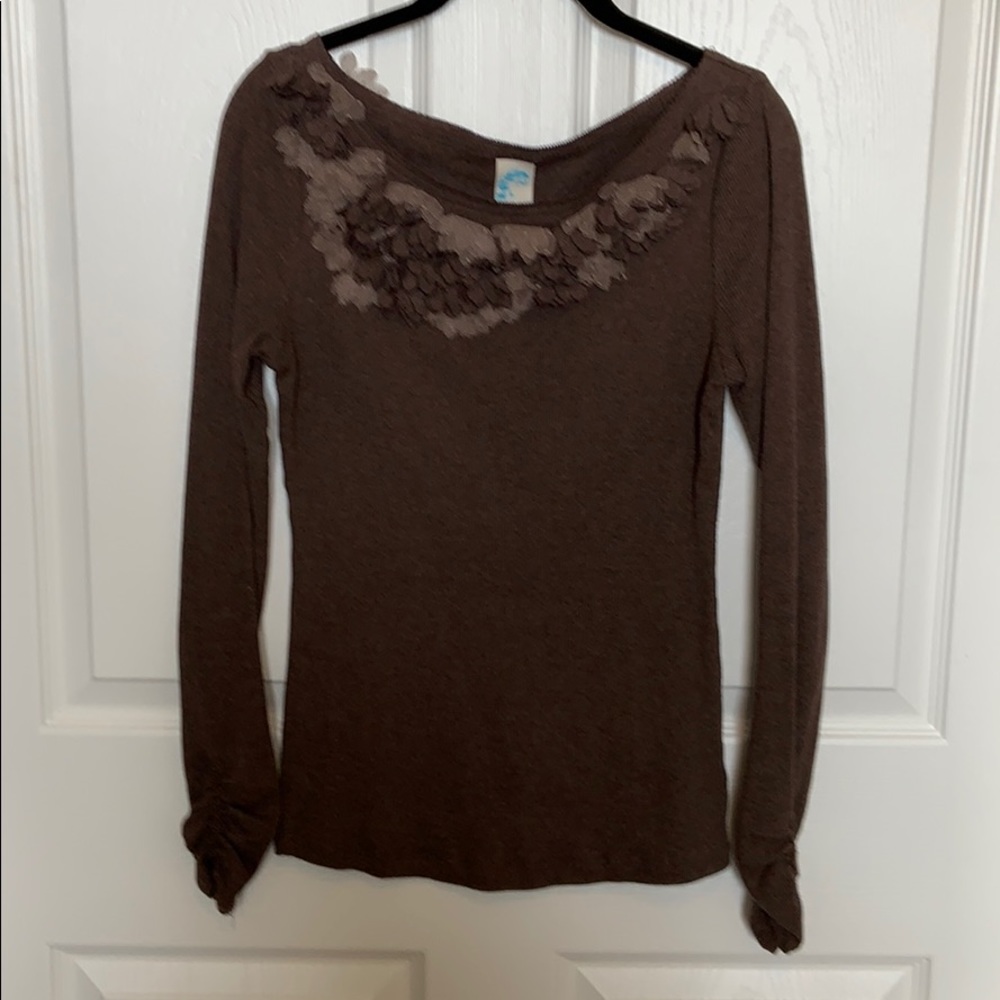 Sweater with accented neckline and back shoulder